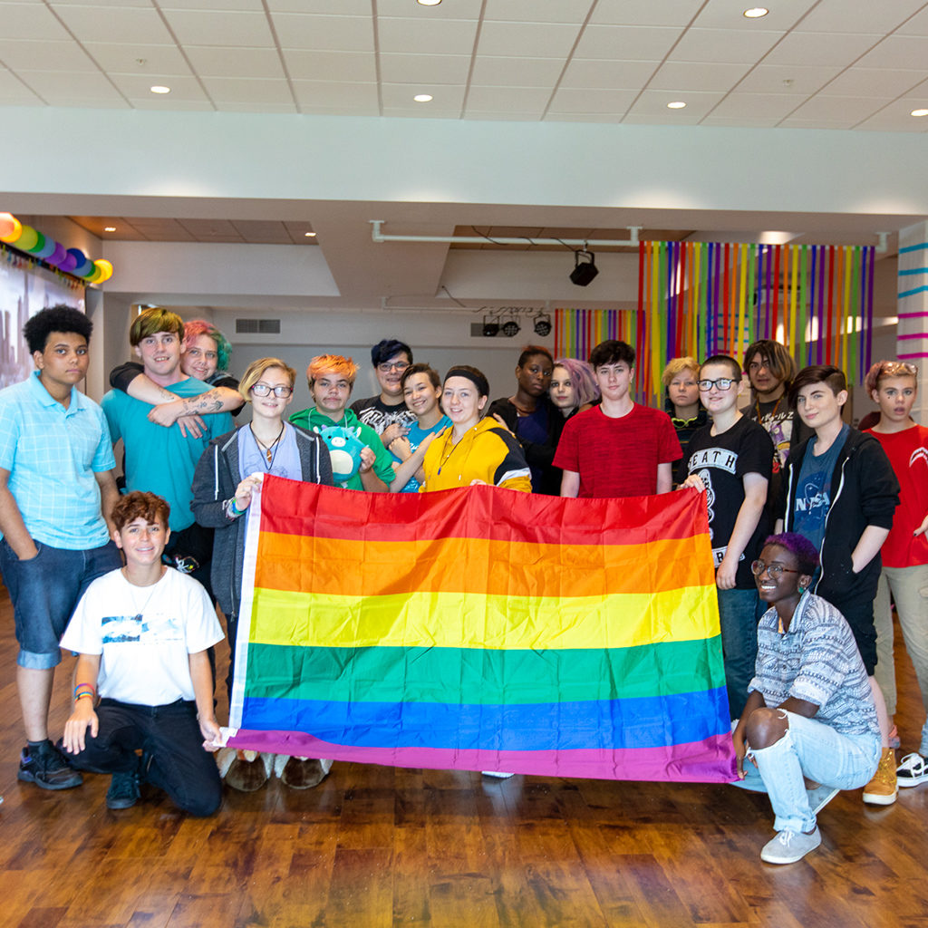 METRO Youth Peer Support and Youth Nights - with Rainbow Pride Flag. These spaces give 13-17 year olds space for socializing and peer support.