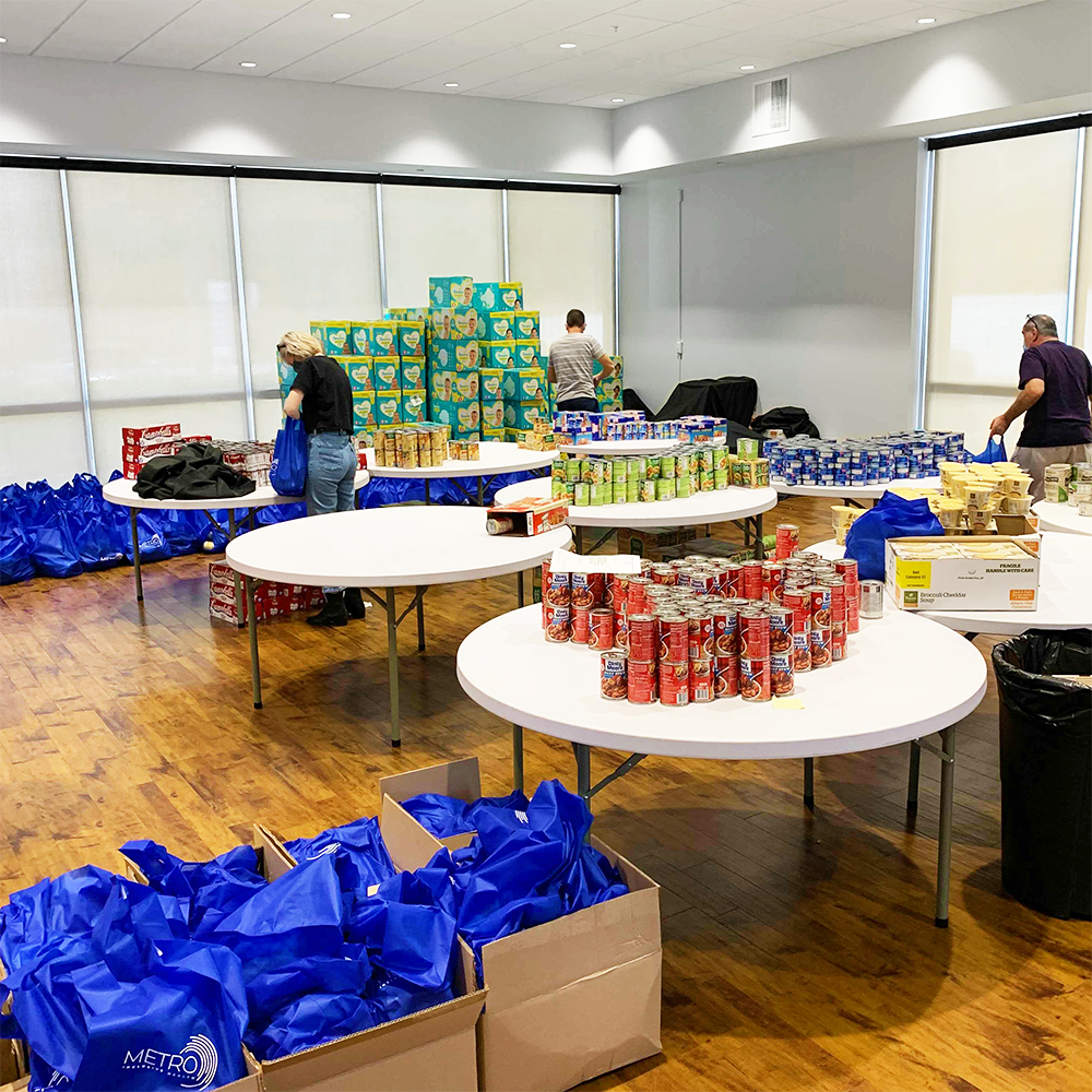 Give, support and get involved. METRO Volunteers pack food bags for Tampa Bay clients in need of basic pantry items.